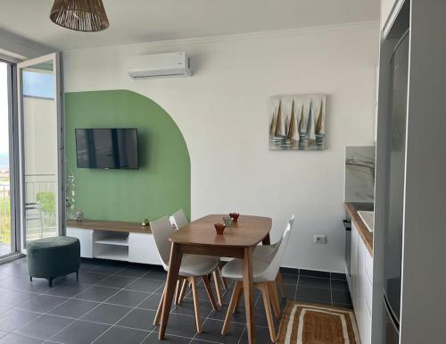 TV a/nebo společenská místnost v ubytování Andrra Apartment - Talea Coast