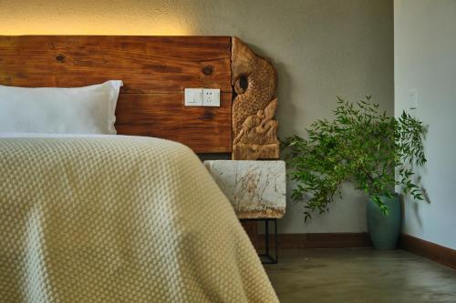 Postel nebo postele na pokoji v ubytování Nature Cure Village Lodge-婺源自在舍