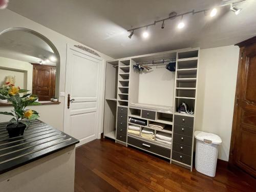 a kitchen with a walk in pantry with at La Cyprienne in Saint-Cyprien
