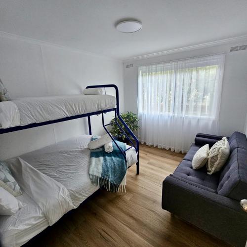 Una cama o camas en una habitación de Prom Coast - Seabreeze