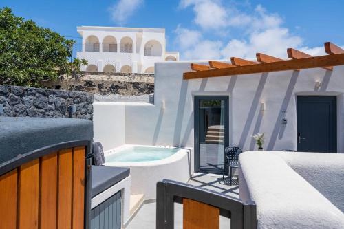 a villa with a swimming pool and a house at LyMaRou Collection in Megalokhori