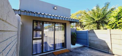 a house with a glass door and a fence at 180 on Emmet in Vryheid