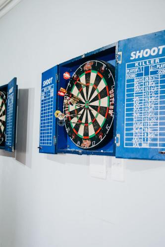 a dart board in a box on a shelf at Laaiplek Hotel in Velddrif