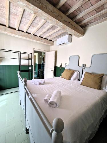 Ένα ή περισσότερα κρεβάτια σε δωμάτιο στο Borgo Dolciano