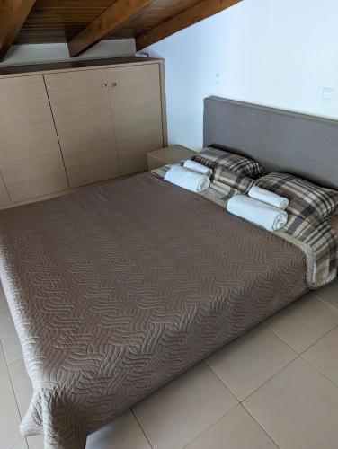 Ένα ή περισσότερα κρεβάτια σε δωμάτιο στο Samaras Apartments in Kamena Vourla