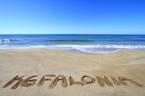 a beach with the word melbourne written in the sand at One Bedroom Apartment Erato in Argostoli
