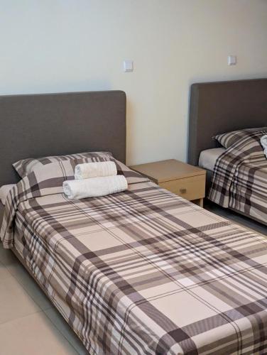 Ένα ή περισσότερα κρεβάτια σε δωμάτιο στο Samaras Apartments in Kamena Vourla