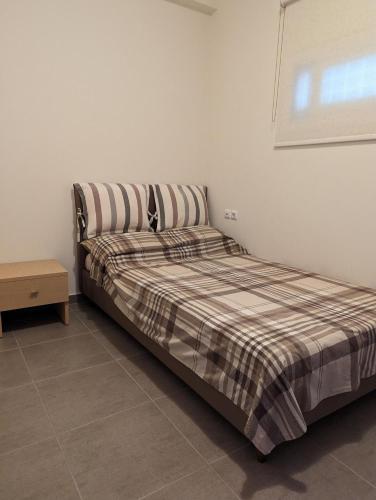 Ένα ή περισσότερα κρεβάτια σε δωμάτιο στο Samaras Apartments in Kamena Vourla
