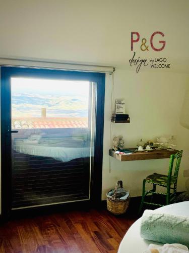 a room with a window with a view of a bedroom at P&G design by Lago Welcome Enna in Enna