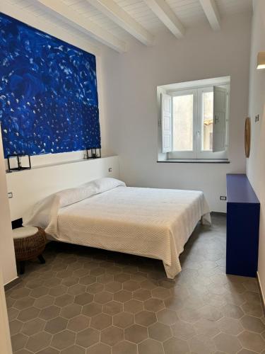 Postel nebo postele na pokoji v ubytování Appartamenti Sparanello
