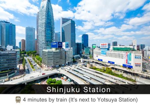 a view of a city with buildings and a freeway at Tokyu Stay Yotsuya Shinjuku in Tokyo