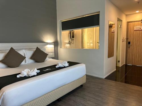 Postel nebo postele na pokoji v ubytování Hotel Arissa
