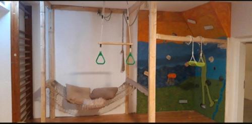 a childs room with a play room with a climbing wall at Familienhof Funny in Galenbeck