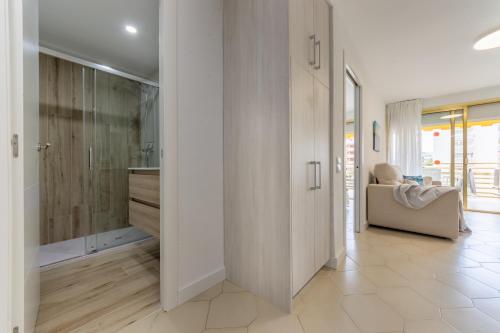 a bathroom with a walk in shower next to a bathroom at NOVELTY III Arysal 3 in Salou