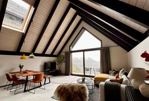a living room with a couch and a table at BOJ Casas de Montaña in Bielsa