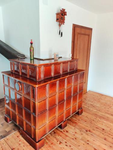 a wooden dresser with a bottle on top of it at Wellness- HotTub & Sauna- Pet Friendly- Hiking in Keutschach am See