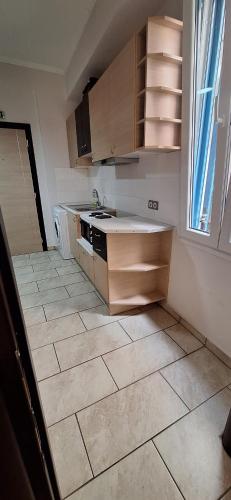 an empty kitchen with a sink and a stove at KAMPANI STUDIO in Chios