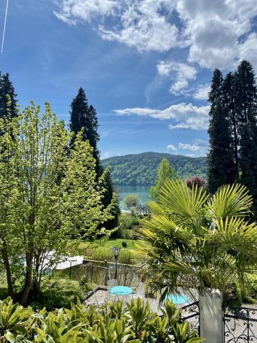 a garden with a view of a lake at Haus Marianne in Millstatt