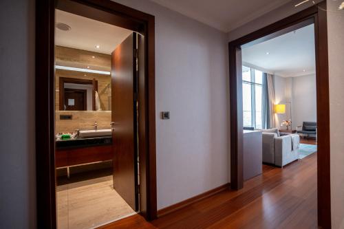 a room with a door leading to a bathroom at Sundance Hotel Istanbul in Istanbul