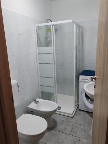 a bathroom with a shower and a toilet and a sink at Marconi in Novi Ligure