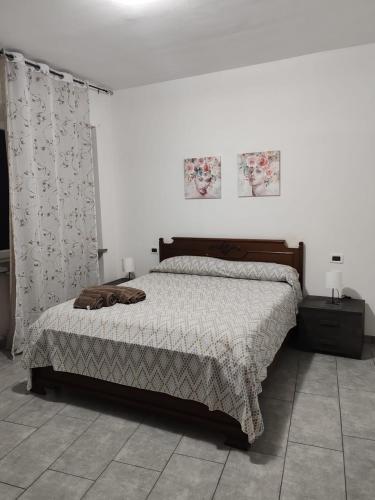 a bedroom with a bed in a white room at Marconi in Novi Ligure