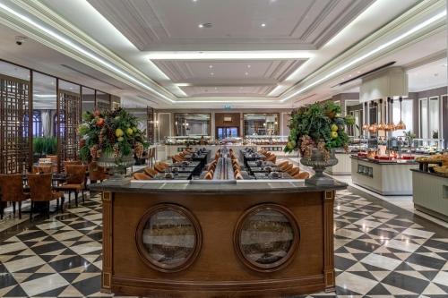 a long buffet in a restaurant with a long table at Lords Palace Hotel SPA Casino in Kérynia