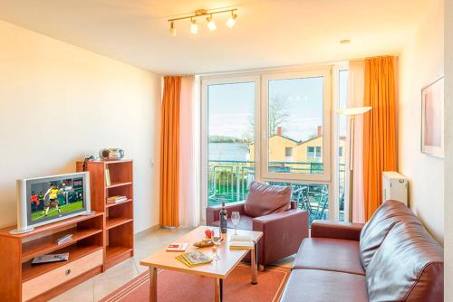 TV a/nebo společenská místnost v ubytování Residenz Meeresblick D Fewo 14