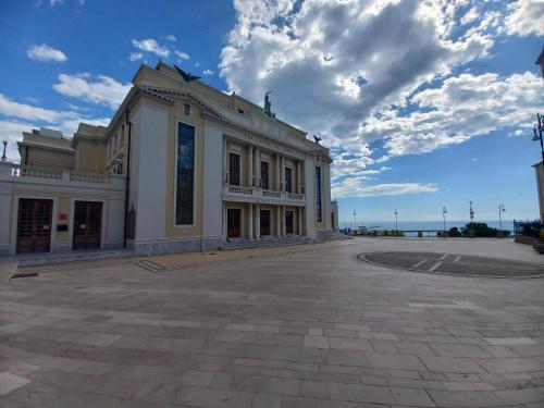 a large white building on the side of a street at Casa degli Ulivi in Ortona
