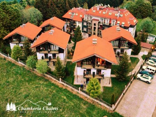 an overhead view of a large house with orange roofs at Chamkoria Chalets 409 in Borovets