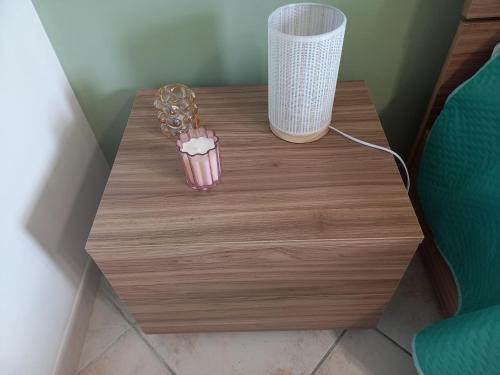 a wooden table with a cupcake on top of it at Casa degli Ulivi in Ortona