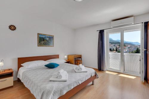 Posteľ alebo postele v izbe v ubytovaní City View Apartment
