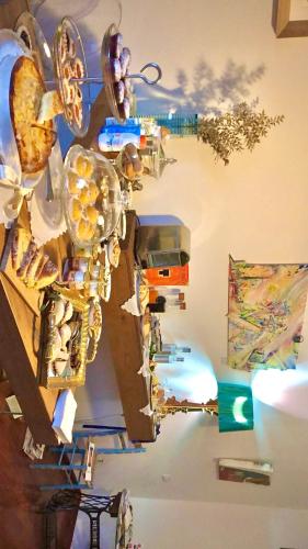 a collage of art on a wall at P&G design by Lago Welcome Enna in Enna
