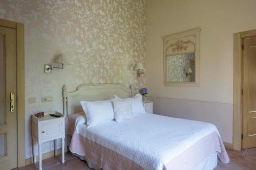 Hotel Rural Arpa de Hierbaにあるベッド