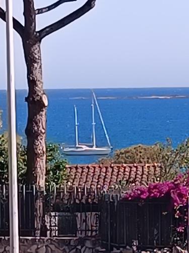 a view of the ocean with boats in the water at Appartamento turistico Olivella in Formia