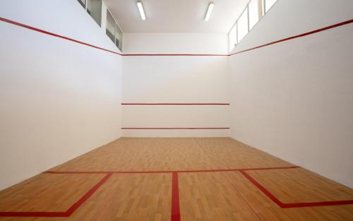 an empty room with a wooden floor and white walls at Club Hotel Drago Park in Costa Calma