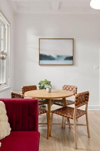 a dining room with a table and chairs at Holiday Home by Barangaroo Reserve in Sydney