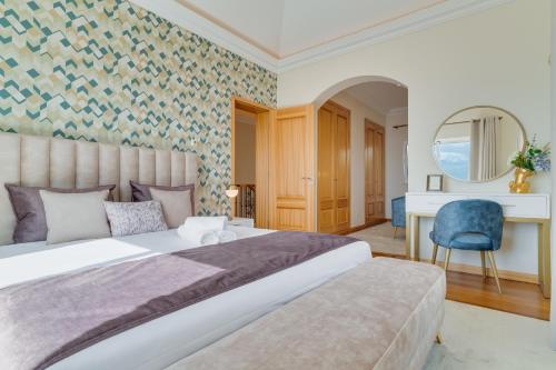 Katil atau katil-katil dalam bilik di Balancal Apartments and Villas Palheiro Village