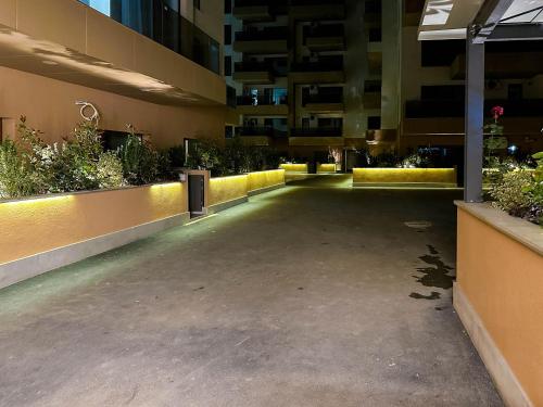 an empty parking lot in a building with plants at ACM Premium 3 camere Apartament elegant in Voluntari
