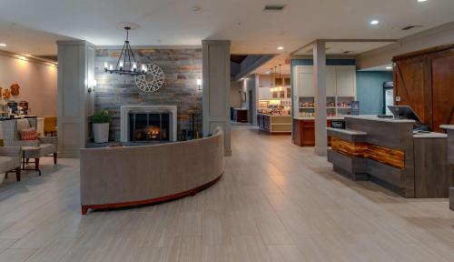 a lobby of a store with a fireplace at Homewood Suites by Hilton Ft. Worth-Bedford in Bedford