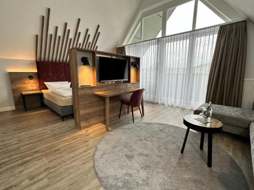 Una cama o camas en una habitación de Hotel Mainpromenade ***S