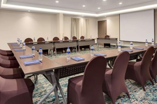 a conference room with a long table and chairs at Hampton By Hilton San Jose Airport Costa Rica in Alajuela City