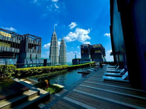 a view of the city with the petronas towers at Star Residence Suite KLCC in Kuala Lumpur