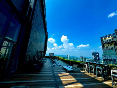 a row of benches on the side of a building at Star Residence Suite KLCC in Kuala Lumpur