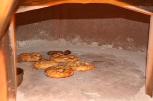 a group of donuts are coming out of an oven at Agriturismo Ca' Montioni in Mercatello sul Metauro