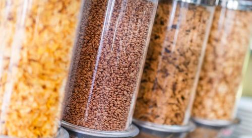 a row of glass jars filled with cereal and beans at Rydges Esplanade Resort Cairns in Cairns