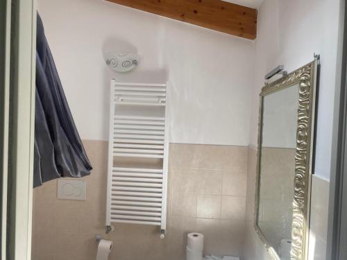 a bathroom with a shower and a mirror at Finale Ligure Gorra Rooms Rosa di Mare vicino al mare lontano dal caos! in Borgio Verezzi