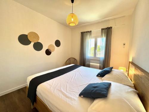 a bedroom with a bed with planets on the wall at Vila Vera Seafront Apartments in Sumartin