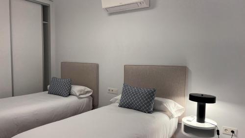 Ένα ή περισσότερα κρεβάτια σε δωμάτιο στο Villas Alondra