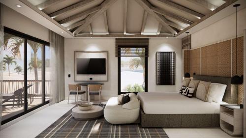 a bedroom with a large bed and a television in it at Zemi Miches Punta Cana All-Inclusive Resort, Curio by Hilton in Miches