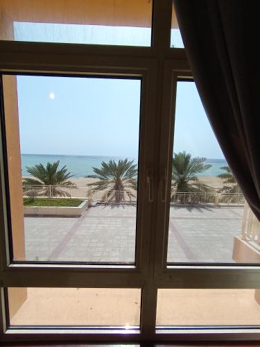 a view of the ocean from a window at روز الشاطي إطلالة بحرية Rose Sea View in King Abdullah Economic City